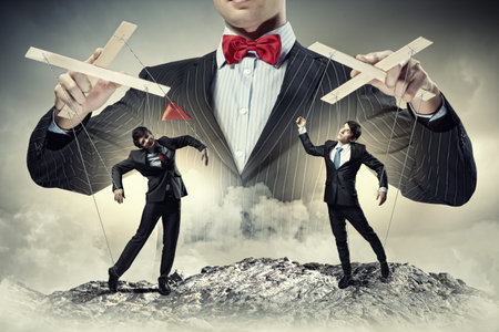 Image of young businessman puppeteer  Leadership concept