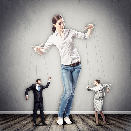 Image of pretty businesswoman puppeteer  Leadership conceptの写真素材