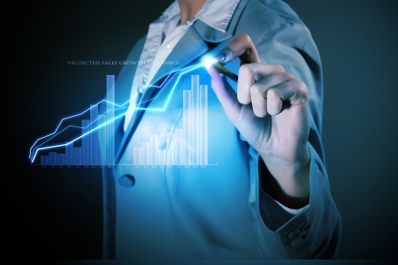 Image of businesswoman in grey suit drawing graphの写真素材