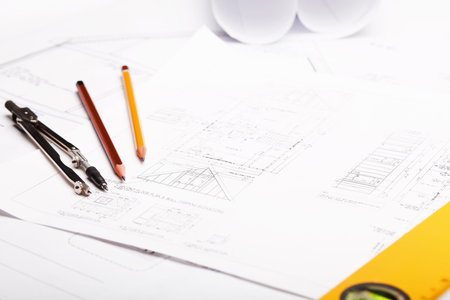 Tools and papers with sketches on the table
