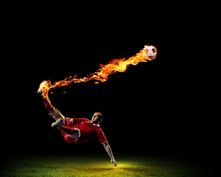 Image of football player in red shirtの写真素材