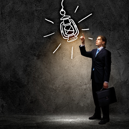 Image of businessman in black suit against dark backgroundの写真素材