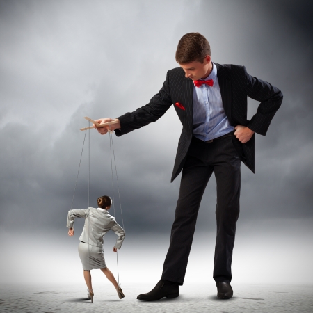 Image of young businessman puppeteer  Leadership conceptの写真素材