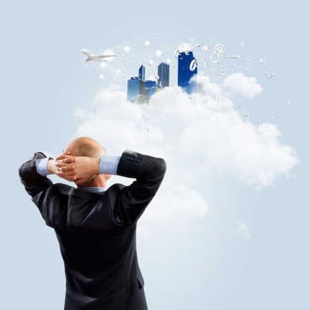 Image of thoughtful businessman standing with backの写真素材