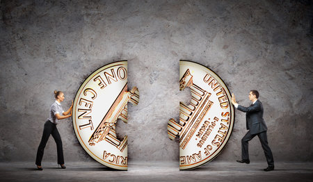 Two business people pulling coins  Currency concept