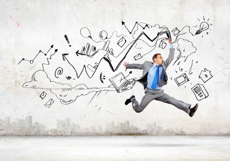 Image of businessman in jump against sketch backgroundの写真素材