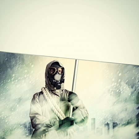 Stalker in gas mask with blank banner  Disaster conceptの写真素材