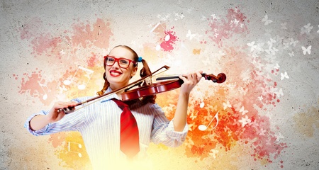 Image of young funny woman with violin against color backgroundの写真素材