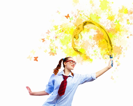 Image of young woman painter with brushの写真素材