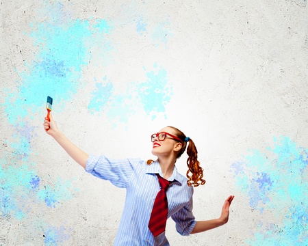 Image of young woman painter with brushの写真素材