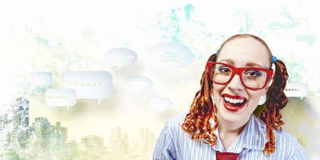 Funny looking red-hair woman with glasses staring at cameraの写真素材