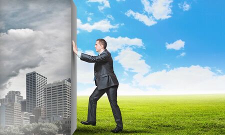 Image of young business man changing realityの写真素材