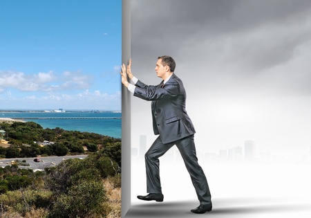 Image of young business man changing realityの写真素材