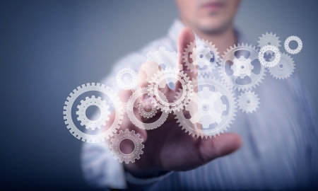 Image of businessman touching gear elements  Mechanism conceptの写真素材