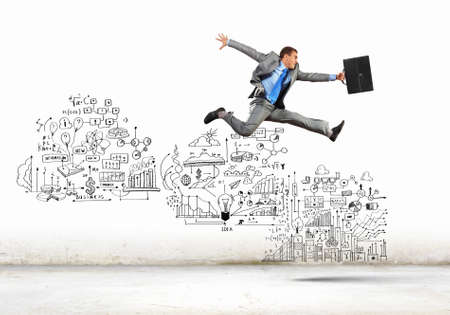 Image of businessman in jump against sketch backgroundの写真素材