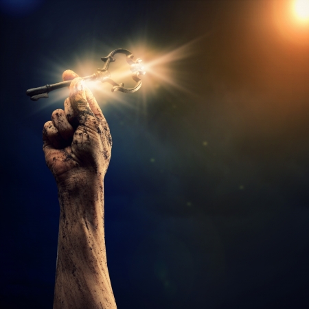 Key in human hand  Struggle and successの写真素材