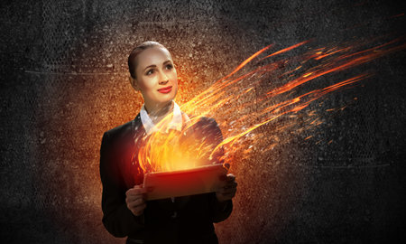 Image of young business woman holding ipad