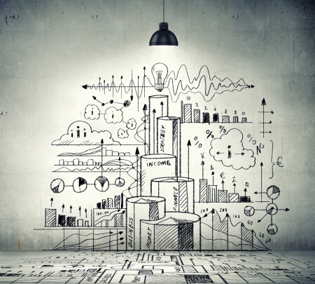 Drawn business plan on wall illuminated by lamp aboveの写真素材