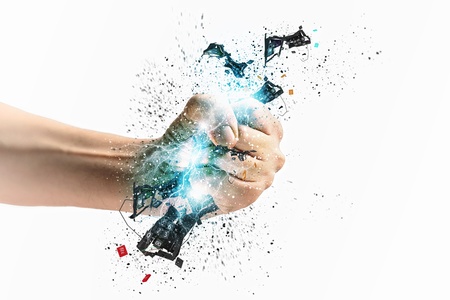 Close-up image of human hand clutching keyboardの写真素材