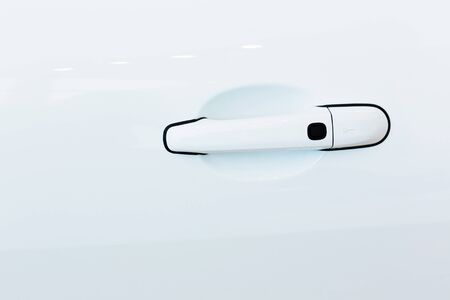 Close up image of white car door handleの写真素材
