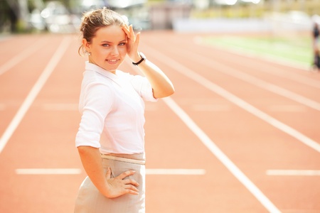 Businesswoman sport manager and executive at athletic stadium and race trackの写真素材