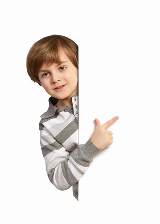 Little boy holding a blank white billboardの写真素材