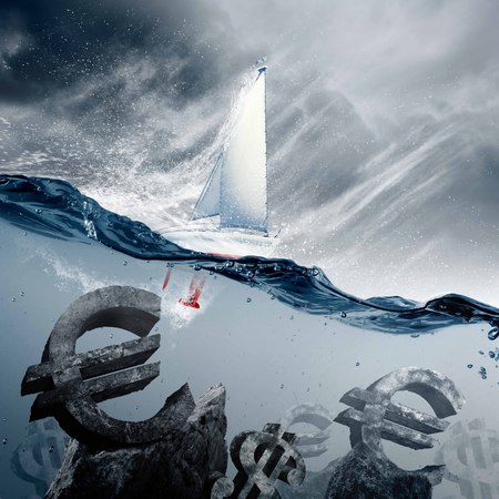 Sunken currency symbols with yacht floating aboveの写真素材