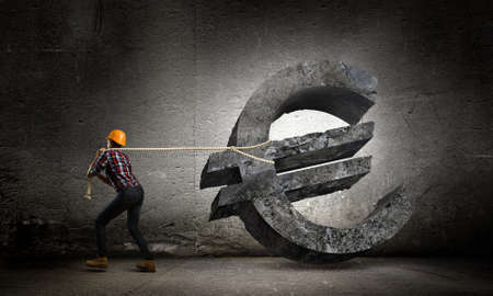 Image of woman engineer pulling euro symbolの写真素材