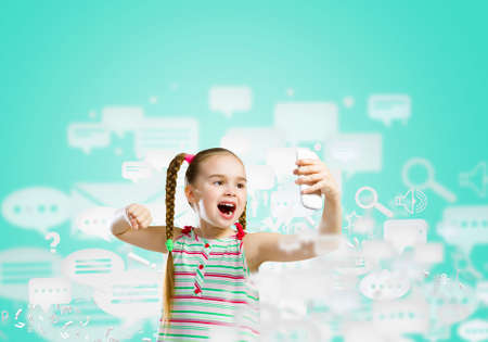 Image of little angry girl shouting in mobile phoneの写真素材