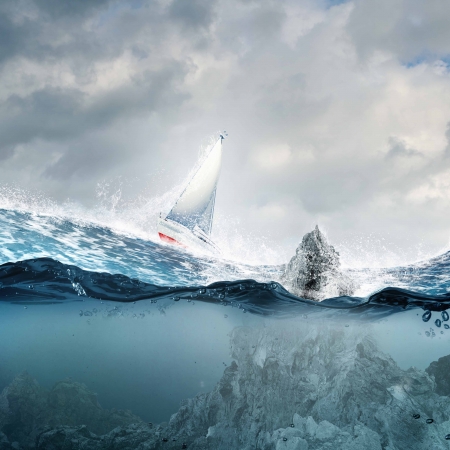 Submerged ocean view with yacht floating aboveの写真素材