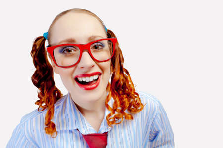 Teenager girl with pigtails in red glassesの写真素材