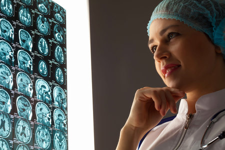 Image of attractive woman doctor looking at x-ray results