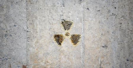 Grey wall with radioactivity symbol  Background imageの写真素材