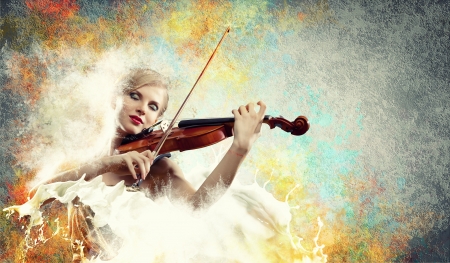 Image of beautiful female violinist playing with closed eyes against splashes backgroundの写真素材