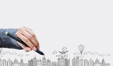 Close up of businesswoman hand drawing sketches with markerの写真素材