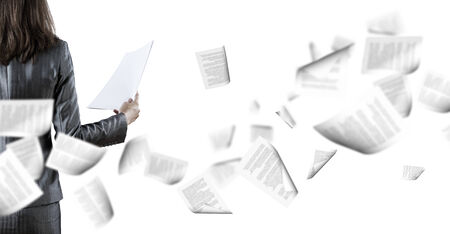 Back view of businesswoman holding papers in handsの写真素材