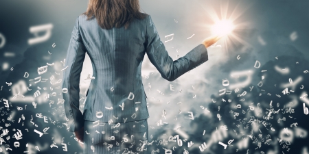 Close up image businesswoman holding sun in palmの写真素材