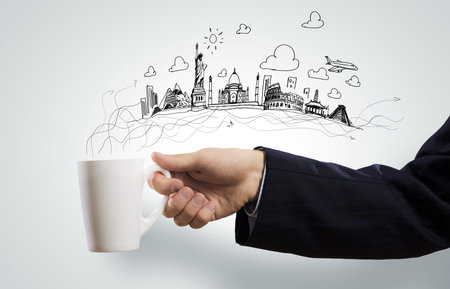 Businessman holding white blank cup in handの写真素材