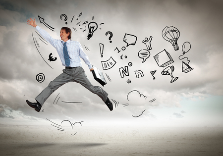 Image of jumping young businessman  Business collageの写真素材