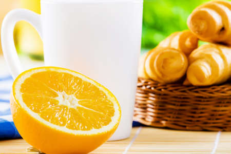 Croissants and cup of coffee on breakfast tableの写真素材