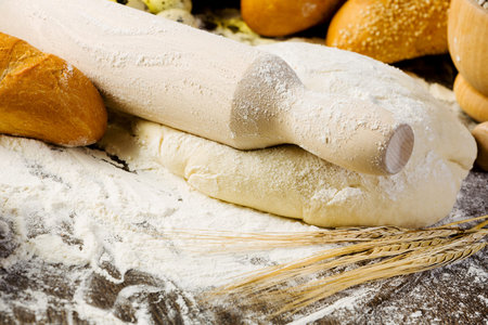 White bread drought and flour on kitchen table