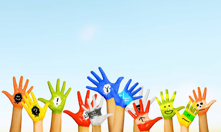 Image of human hands in colorful paint with smilesの写真素材