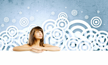 Naked attractive girl with white blank bannerの写真素材