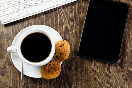 Business work place with cup of coffee calculator and glassesの写真素材