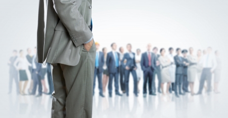 Bottom image of businessman with people at backgroundの写真素材