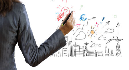 Back view of businesswoman drawing plan or strategyの写真素材