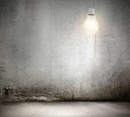 Background image with light bulb in empty roomの写真素材