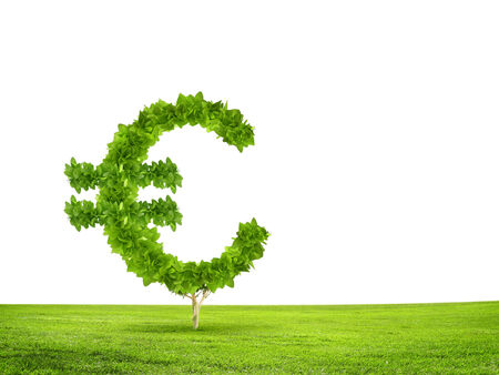 Conceptual image of green plant shaped like euro symbolの写真素材