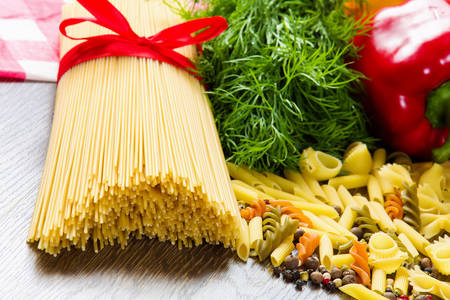 Close up of pepper and other ingredients on kitchen tableの写真素材
