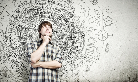 Young thoughtful handsome man in casual thinking over the ideas